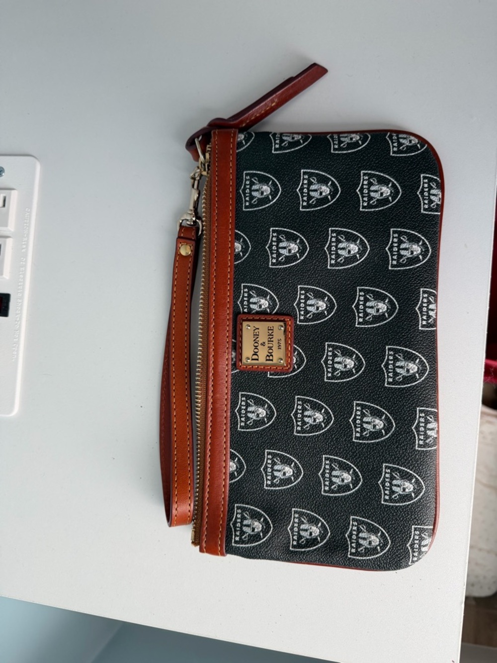 Dooney & Bourke Black Logo Wristlet with Brown Trim and Gold Hardware